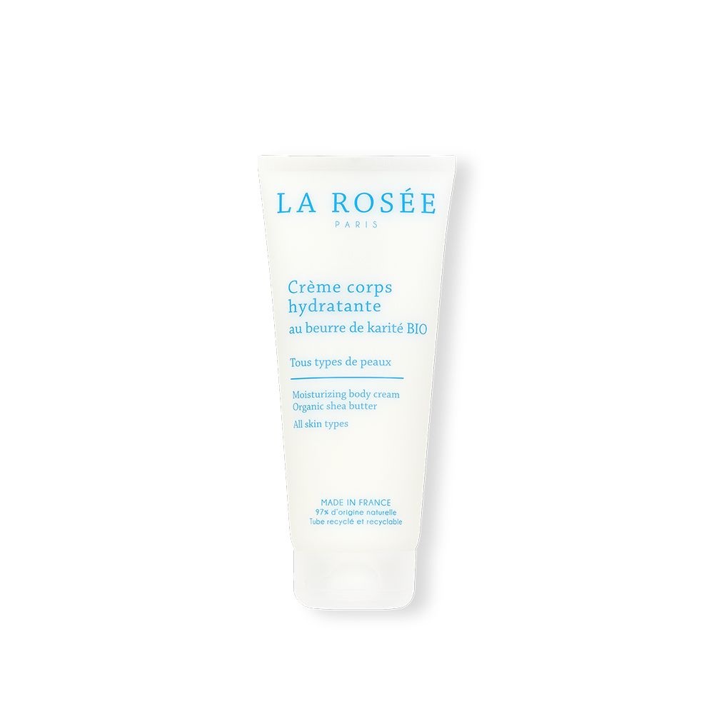Tube blanc avec texte bleu. Crème corps hydratante au beurre de karité BIO. Pour tous types de peaux. Fabriqué en France.
