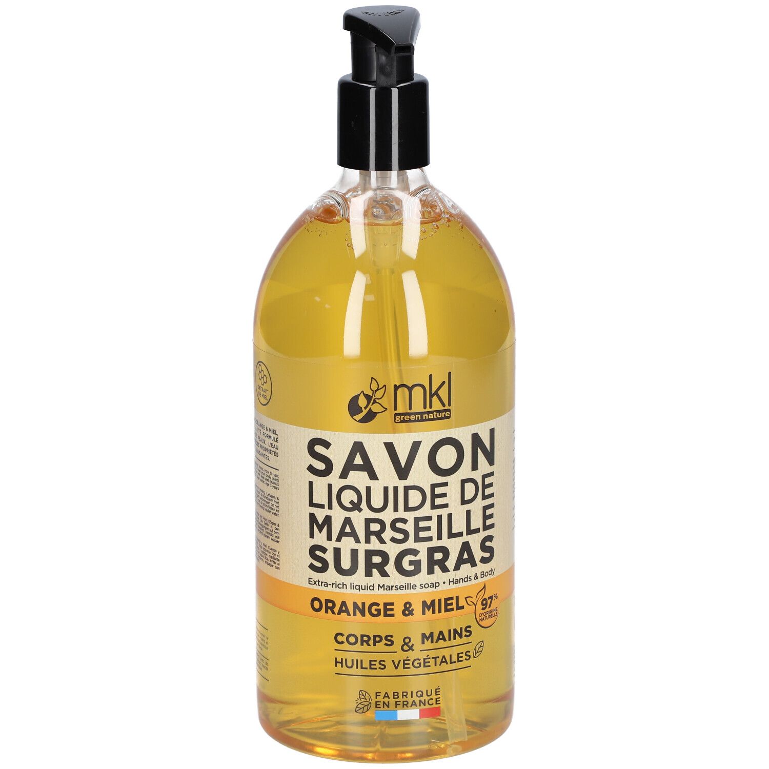 Flüssigseife in einer Flasche mit schwarzem Pumpverschluss. Aufschrift: SAVON LIQUIDE DE MARSEILLE SURGRAS, Orange & Honig.