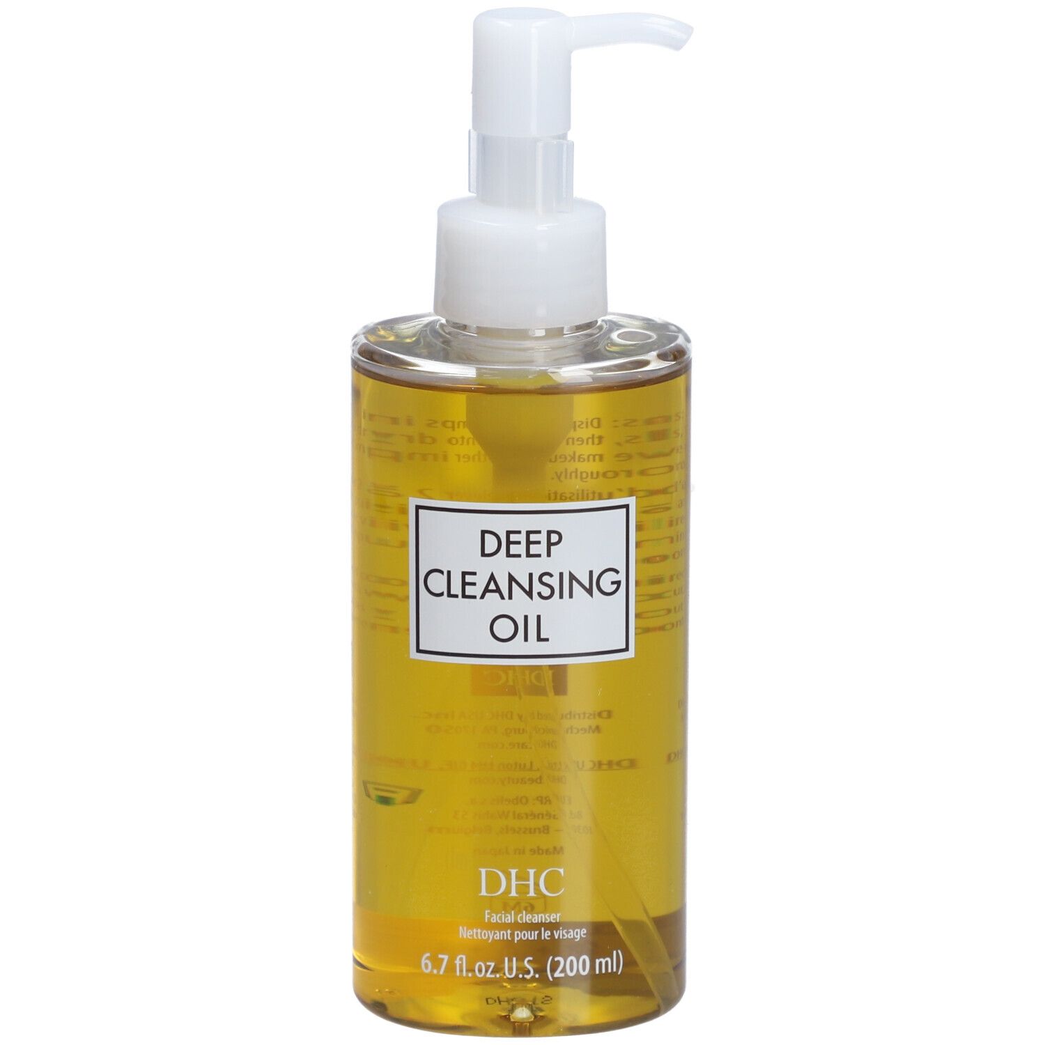 Flacon transparent avec pompe blanche. Étiquette « Deep Cleansing Oil » et « DHC ». Liquide jaune visible.