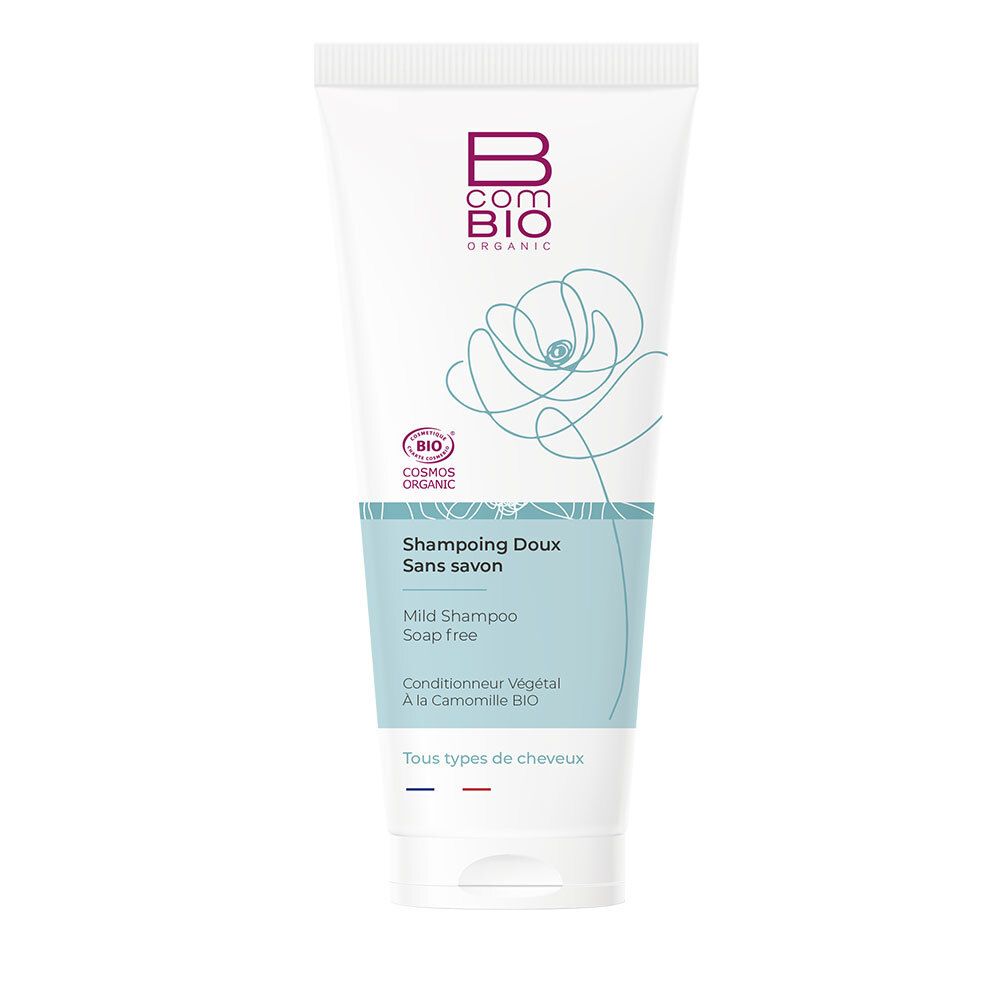 Tube blanc Bcom Bio. Illustration florale et logo. Inscription: Shampooing Doux Sans savon, Mild Shampoo, Conditionneur Végétal.