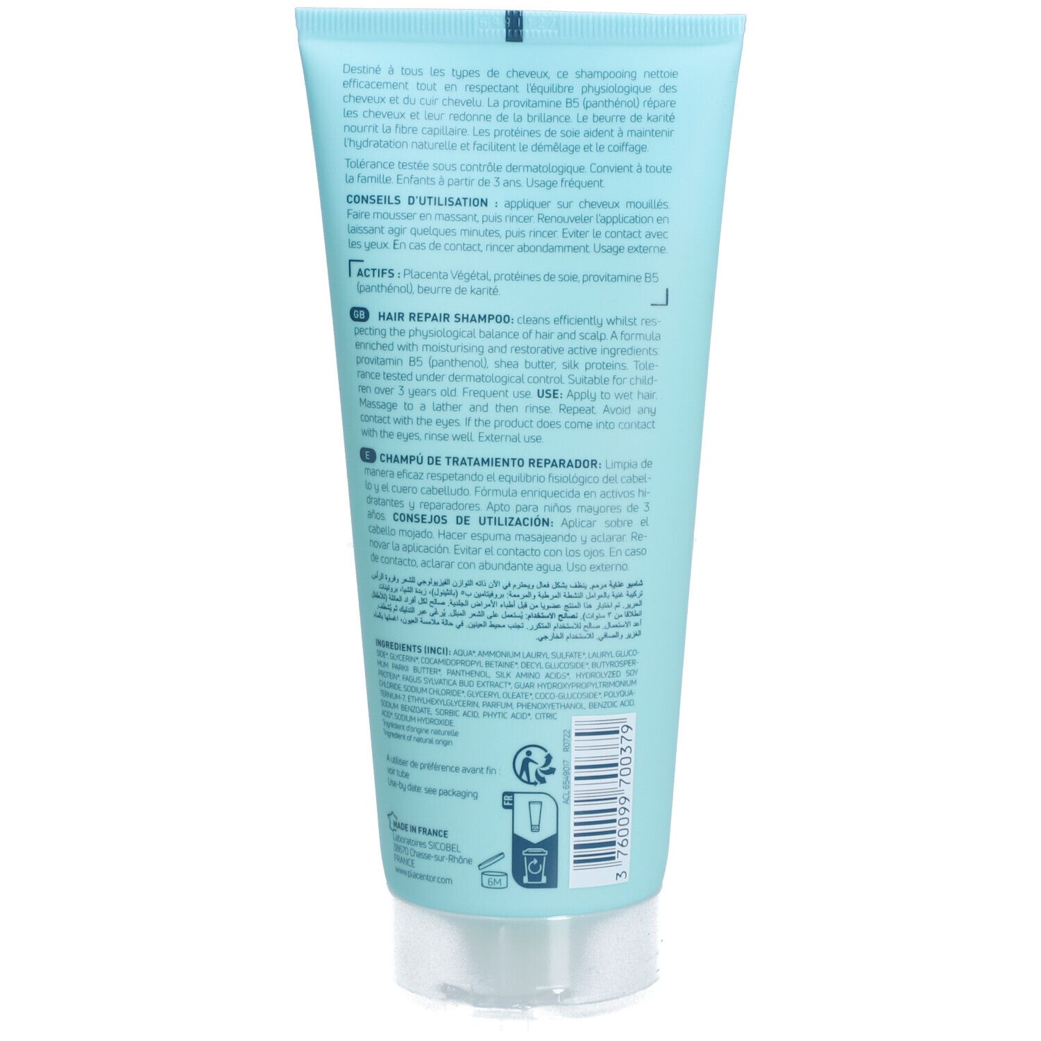 Dos d'un tube bleu clair. Texte multilingue. Bouchon transparent.
