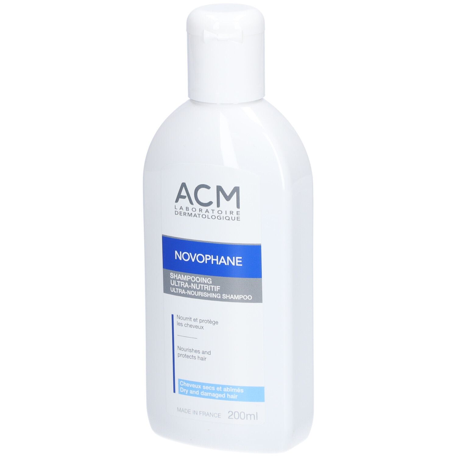 Weiße Flasche mit blauem Etikett. Aufschrift: ACM Novophane Shampooing Ultra-nutritif. Für trockenes, geschädigtes Haar.