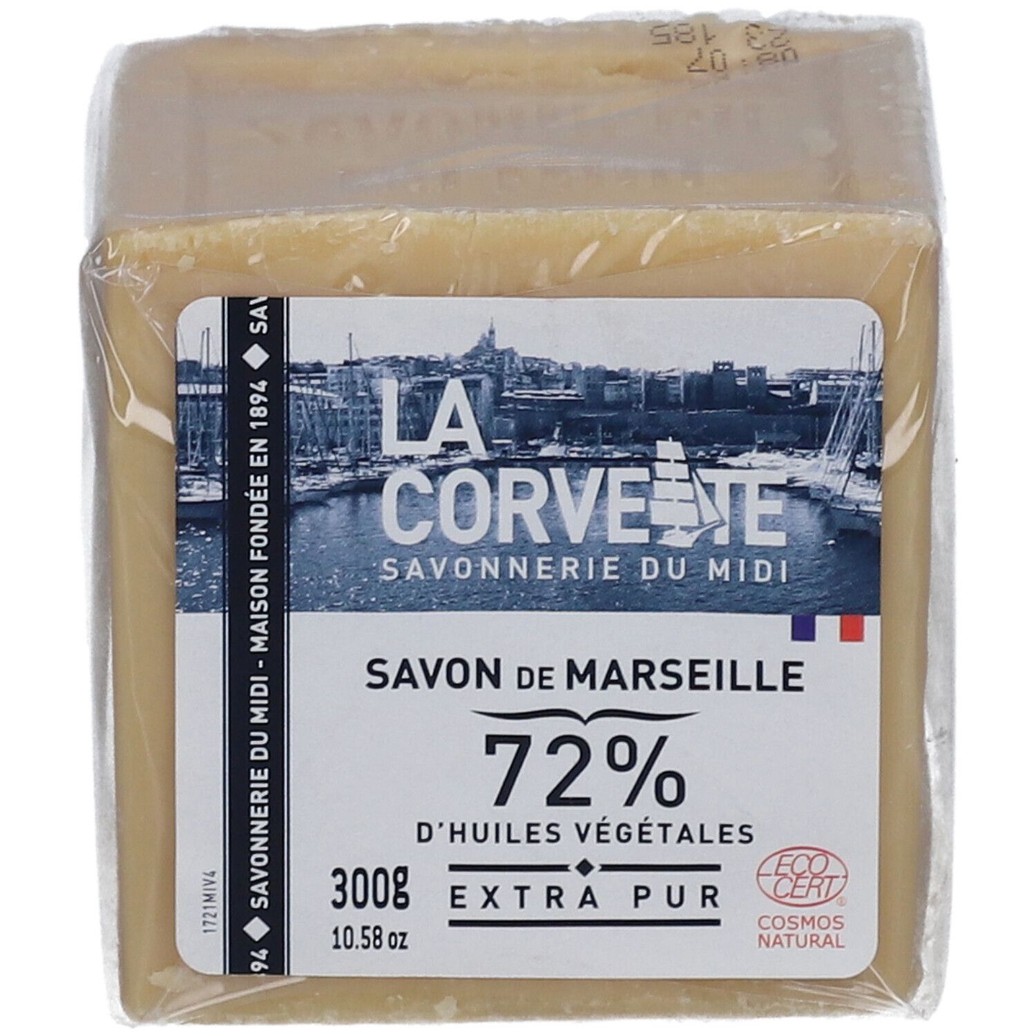 Quadratischer Seifenblock in Folie. Aufkleber mit Logo, Text: Savon de Marseille, 72% d'huiles végétales, 300g, Extra Pur. Französische Flagge.