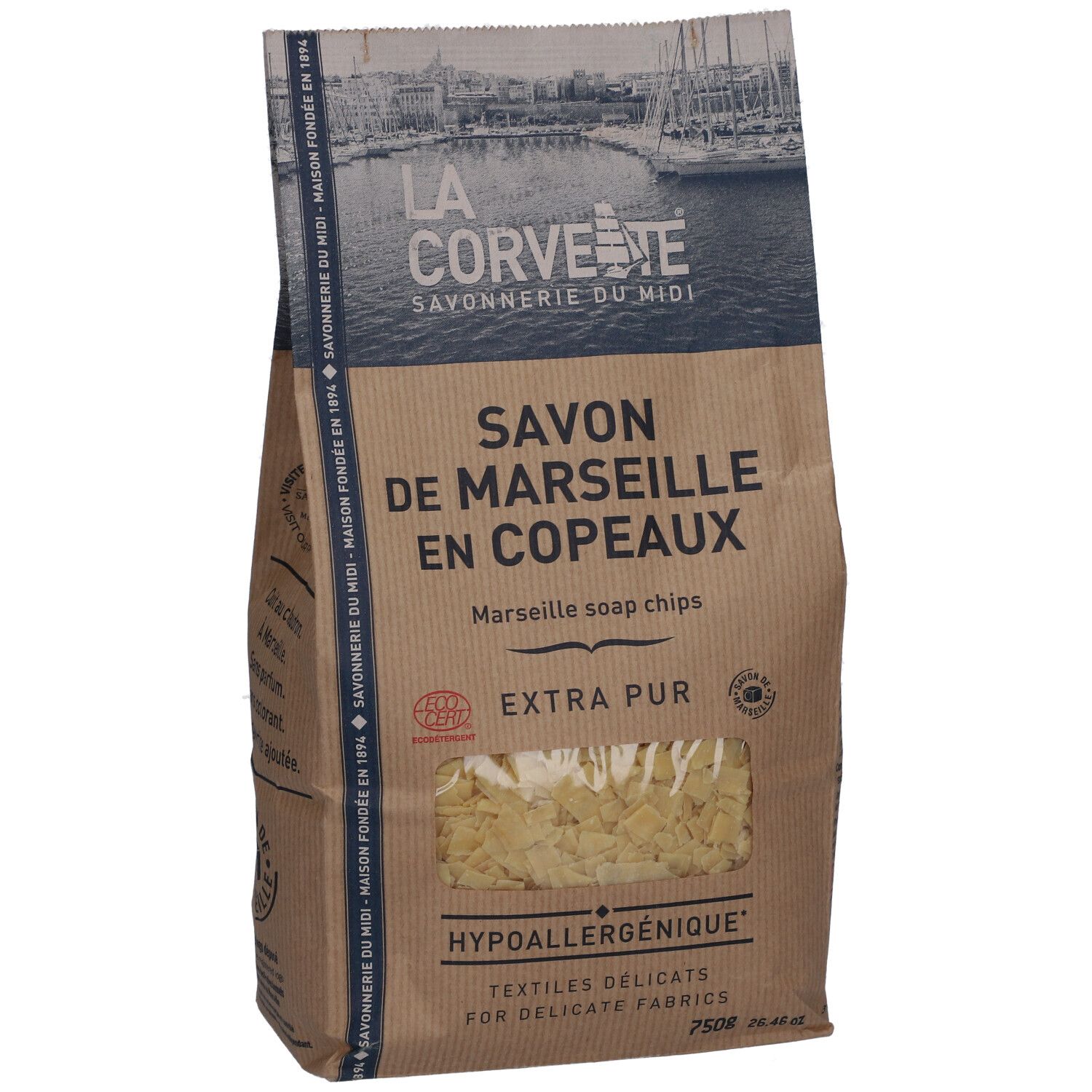 Sac de savon de Marseille en copeaux. Fenêtre montrant des copeaux. Texte: Extra Pur, hypoallergénique.