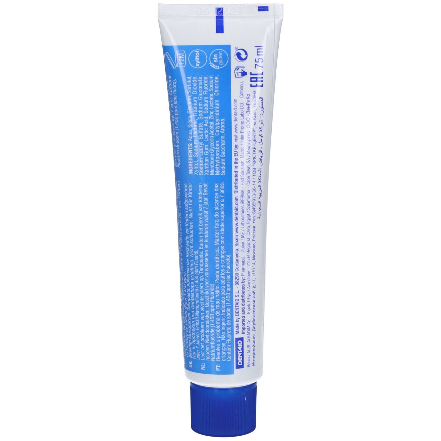 Dos du tube de dentifrice. Contient les ingrédients, le mode d'emploi et les informations du fabricant. Bouchon bleu.