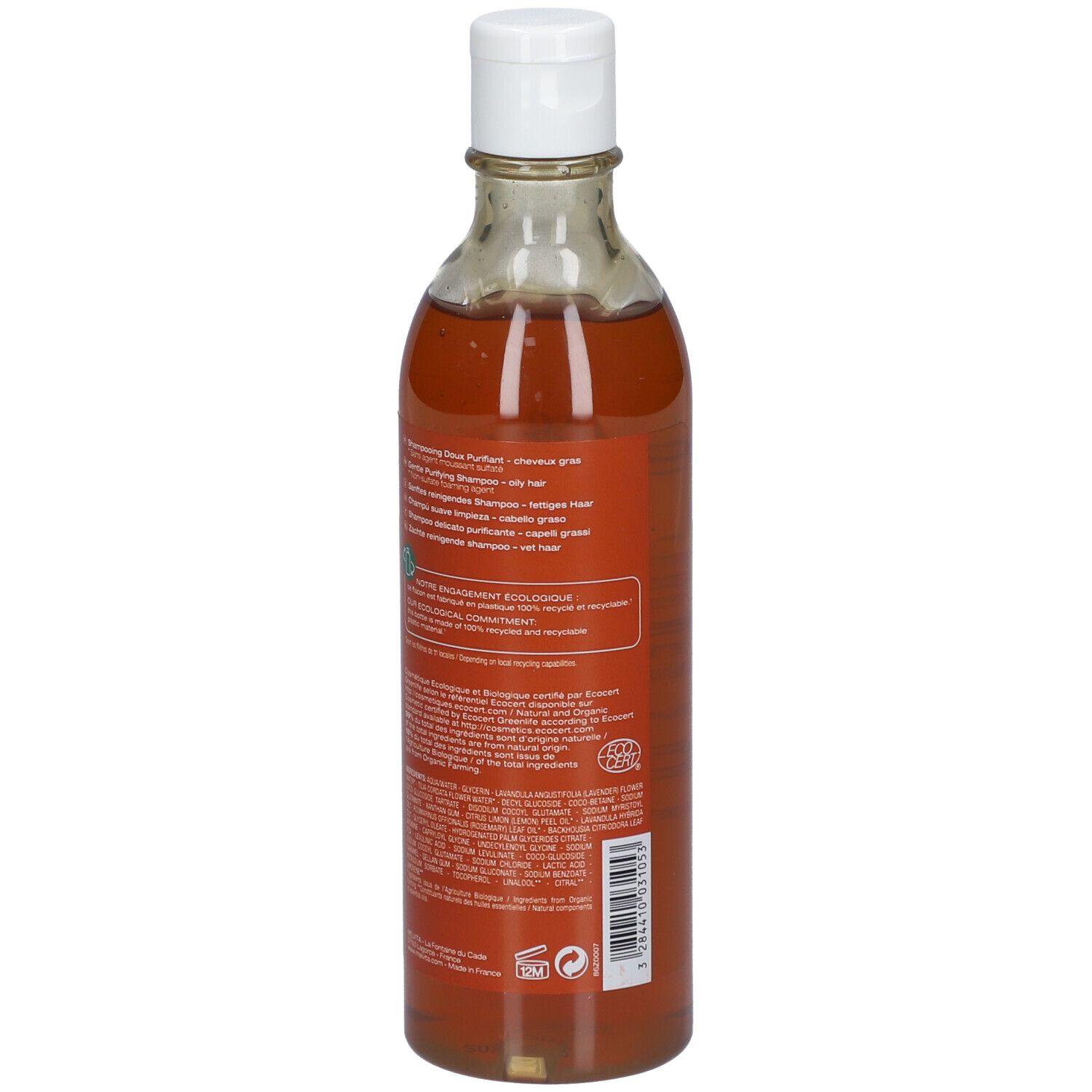 Transparente Flasche mit brauner Flüssigkeit und weißem Deckel. Rückseite mit Text und Logo.
