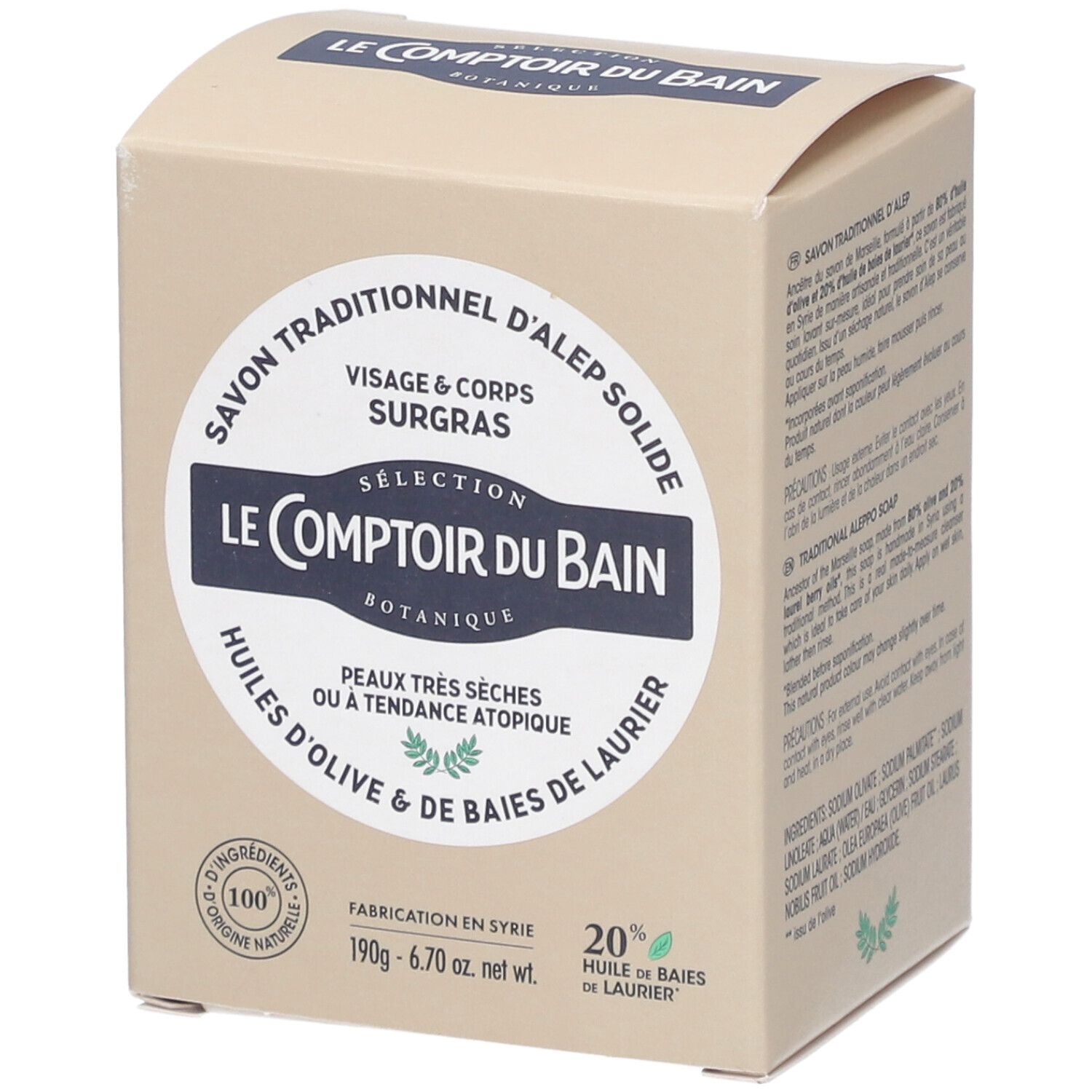 Karton mit Text. Text: Le Comptoir du Bain, Aleppo Seife, für Gesicht & Körper, trockene Haut. 100% natürliche Inhaltsstoffe. Hergestellt in Syrien.