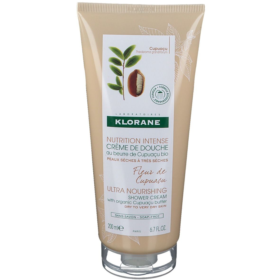 Beigefarbene Tube mit Produktnamen und Illustrationen. Text: "KLORANE", "Nutrition Intense Crème de Douche".