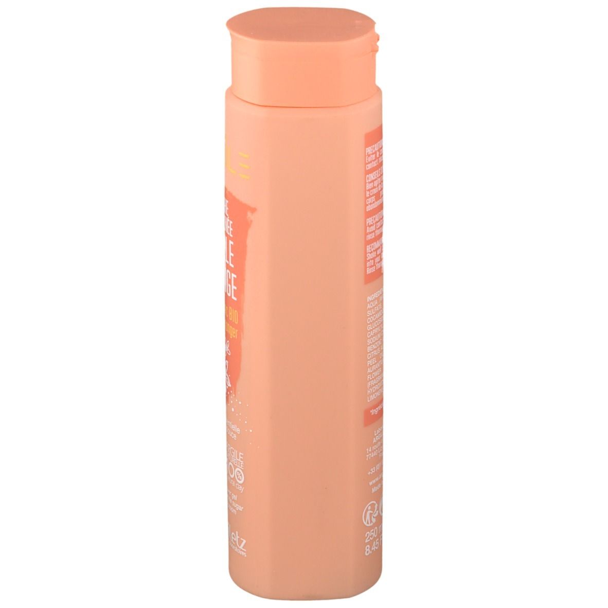 Beige Flasche, Seitenansicht. Orangefarbenes Etikett mit Text. Deckel und Flasche in ähnlichen Farbtönen. Argiletz.