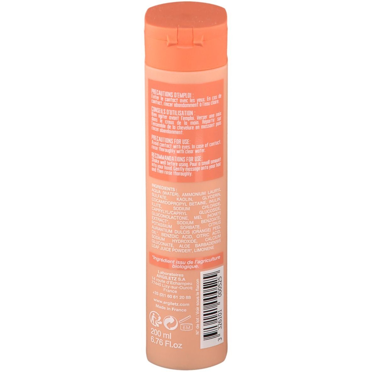 Dos d'un flacon de shampooing beige et bouchon orange. Texte: Précautions, ingrédients, 200 ml, 6.75 fl.oz. Code-barres.