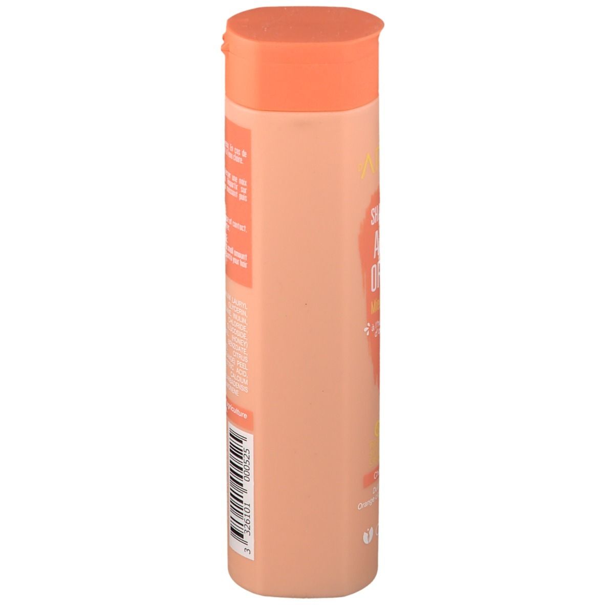 Côté d'un flacon de shampooing beige et bouchon orange. Inscription: Argile Orange Shampoo. Code-barres.