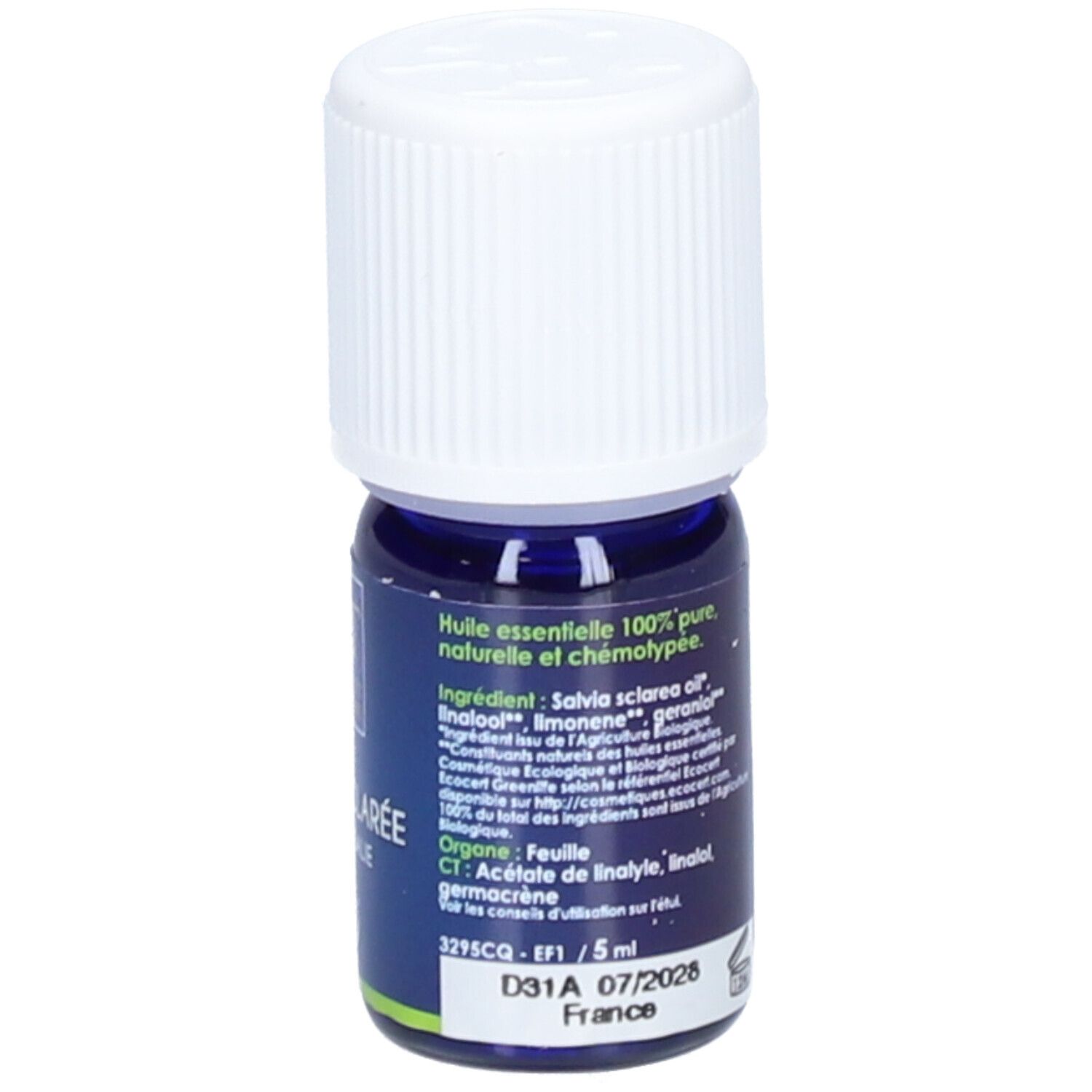 Flacon bleu avec bouchon blanc. Inscription: Huile essentielle, 5 ml, date de péremption.