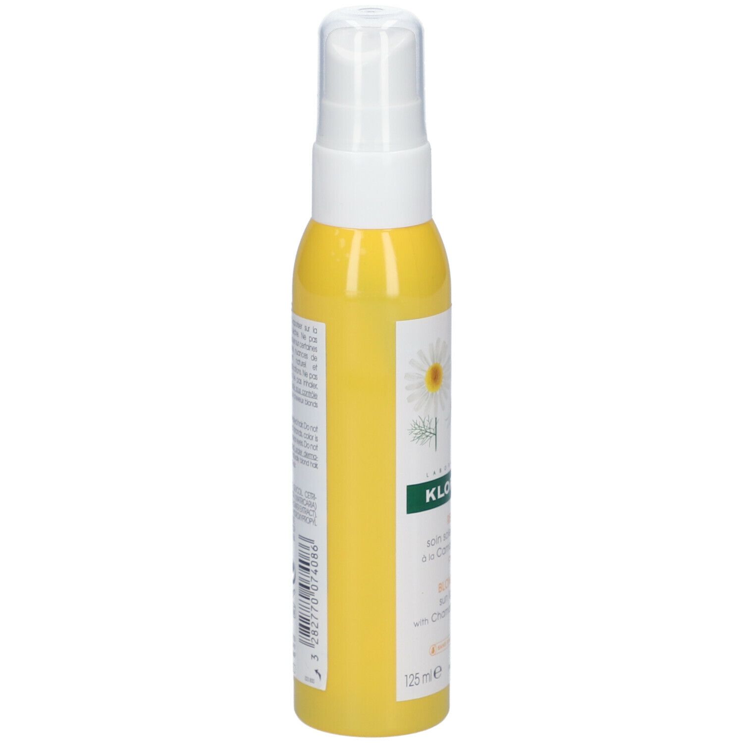 Flacon jaune avec vaporisateur blanc. Inscription: KLORANE. Texte en français. Illustration de fleurs de camomille.