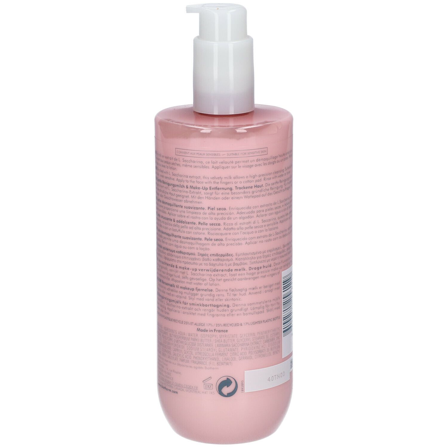 Dos du flacon rose avec pompe blanche. Texte en plusieurs langues.