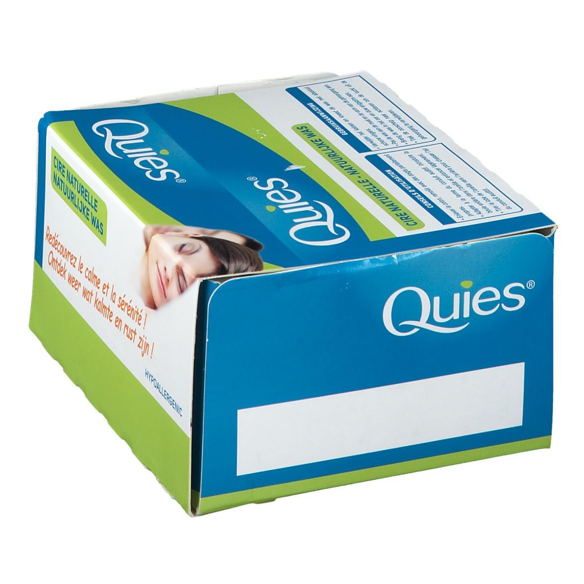 Boîte bleue et blanche avec logo Quies. Inscription: Cire Naturelle, Natuurlijke Was. Image d'une femme. Espace blanc.