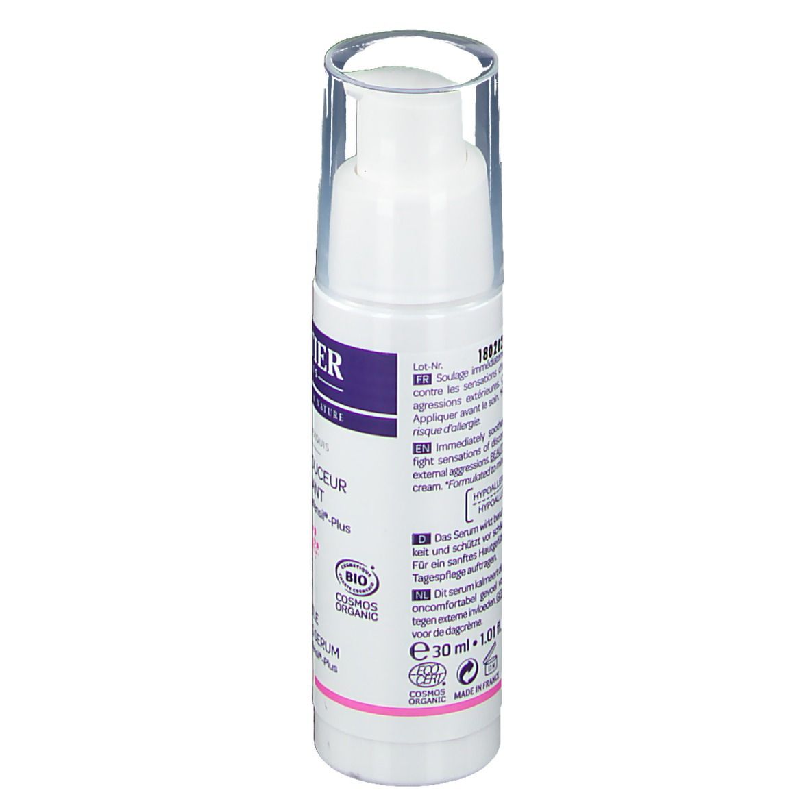 Rückseite der weißen Flasche mit Text. Aufschrift: Sérum douceur apaisant, Defensil®-Plus. Text in mehreren Sprachen.