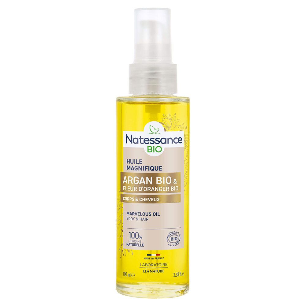 Flacon jaune avec vaporisateur. Inscription: Natessance BIO, Huile Magnifique, Argan Bio & Fleur d'Oranger Bio, Corps & Cheveux.