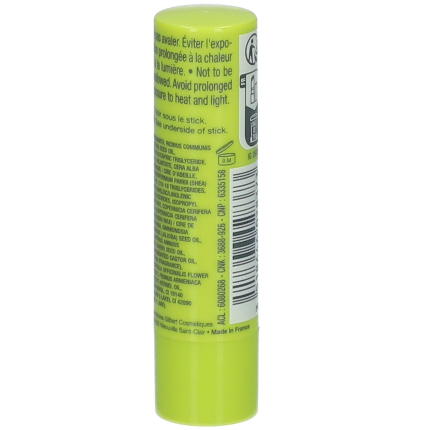Stick de soin des lèvres vert clair. Dos avec ingrédients et avertissements. Texte en français.