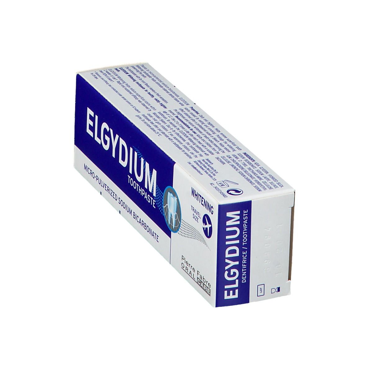 Zahnpasta-Schachtel, blau-weiß. Aufschrift: ELGYDIUM, TOOTHPASTE, MICRO-PULVERIZED SODIUM BICARBONATE. Travel Size.