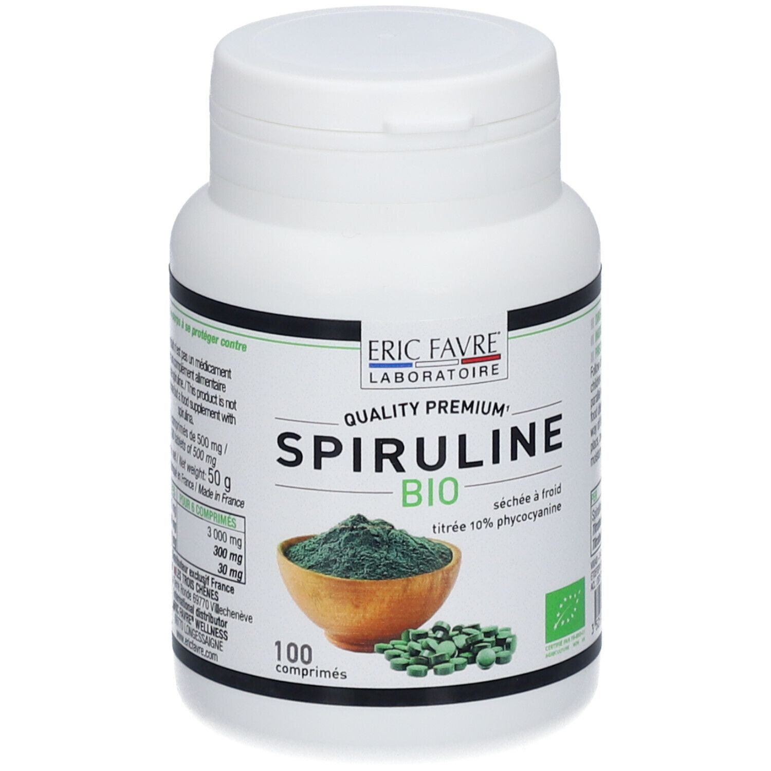 Flacon blanc "ERIC FAVRE Spiruline Bio". 100 comprimés. Poudre verte dans un bol, comprimés verts à côté.