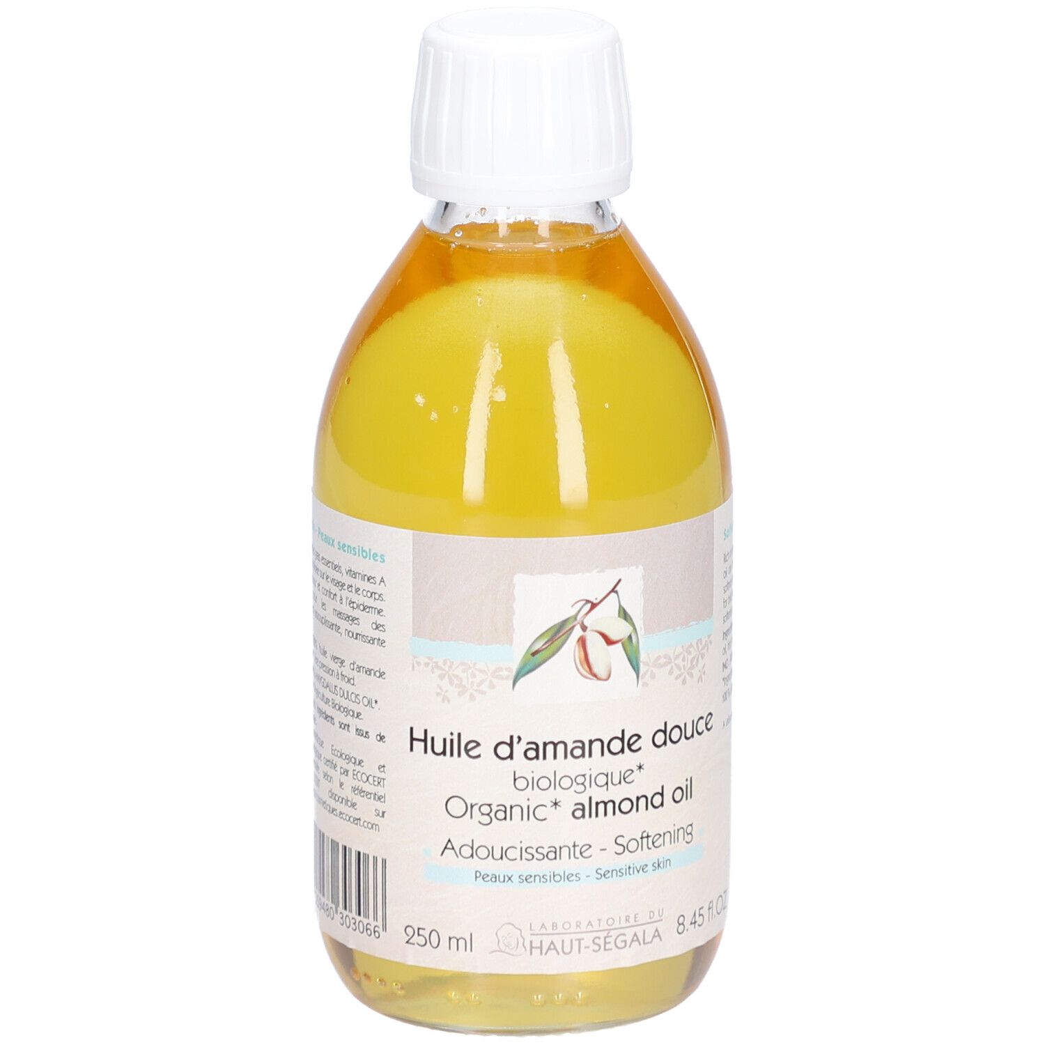 Flacon transparent rempli de liquide jaune. Étiquette avec texte et logo. Bouchon blanc. Inscription: Huile d'amande douce biologique.