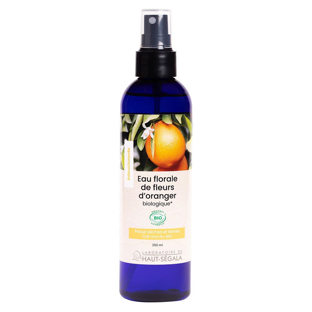 Flacon bleu avec vaporisateur. Étiquette avec illustration de fleurs d'oranger et texte: Eau florale de fleurs d'oranger biologique.