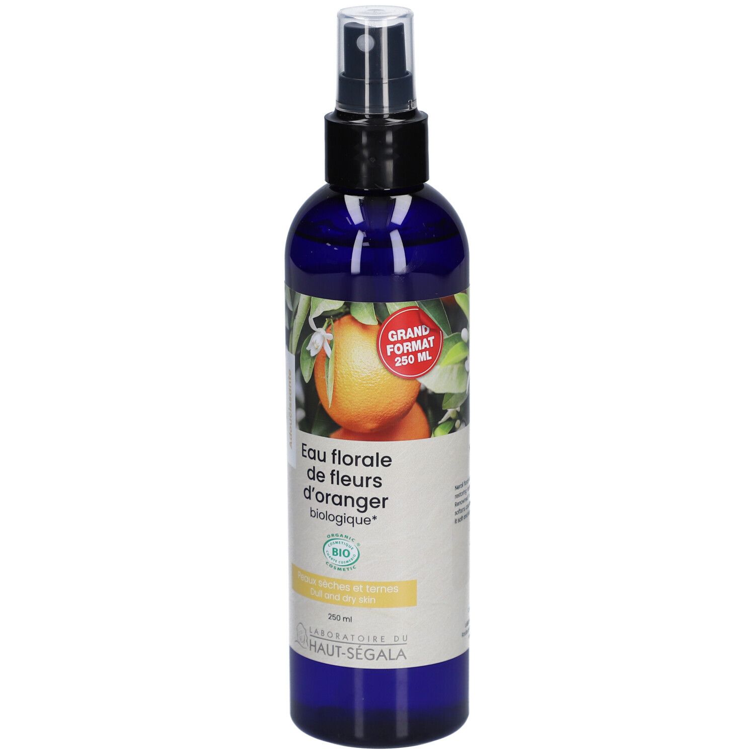 Flacon bleu avec vaporisateur. Étiquette avec illustration de fleurs d'oranger et texte: Eau florale de fleurs d'oranger biologique. Grand format 250 ml.