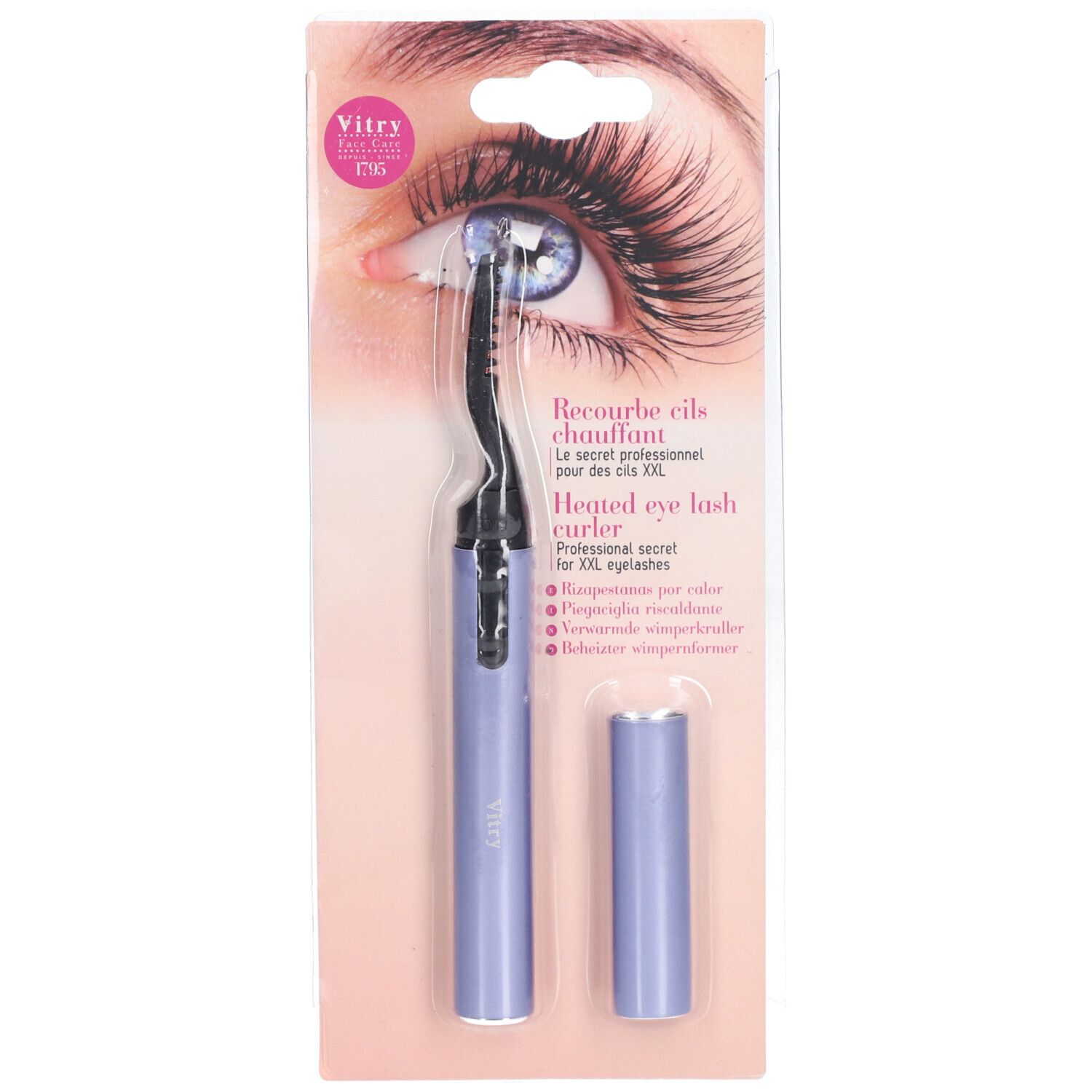 Recourbe-cils chauffant avec étui. Manche violet, pince noire. Emballage avec nom du produit et image d'œil.