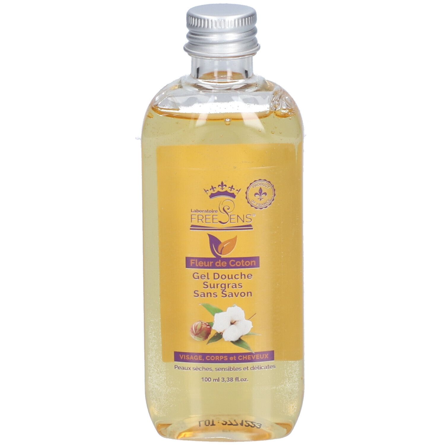 Flacon de gel douche avec étiquette jaune. Inscription: Fleur de Coton, Gel Douche Surgras Sans Savon. Bouchon argenté.