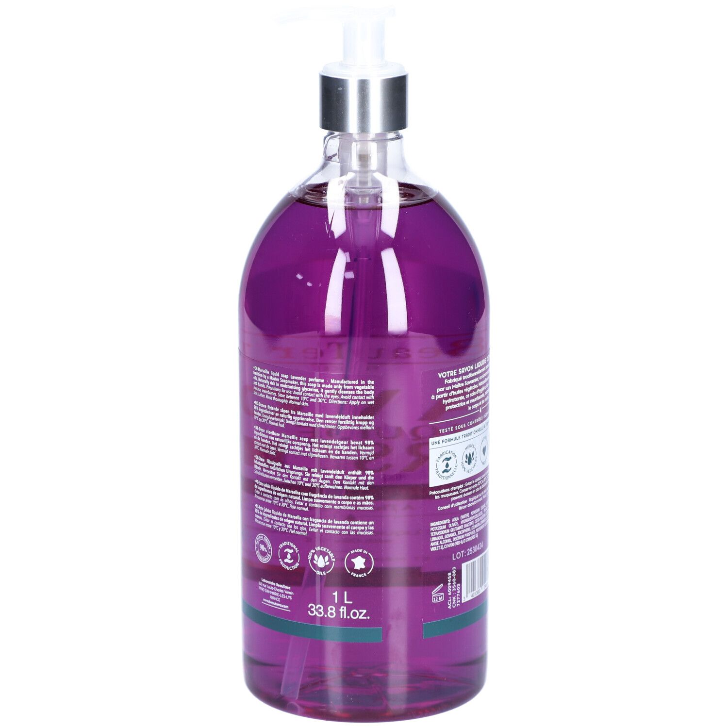 Achterkant van de zeepfles. Tekst en logo's. Groen-witte streep onderaan. 1 L en 33.8 fl.oz.