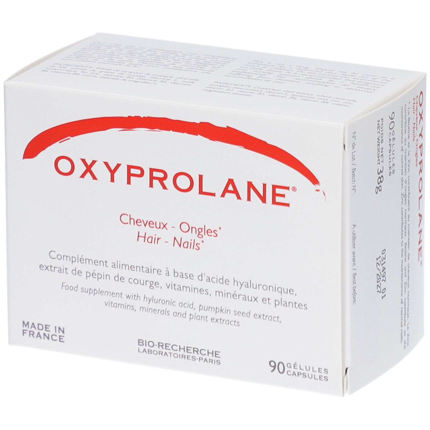 Boîte blanche avec arc rouge et texte. "OXYPROLANE" et "Cheveux - Ongles - Hair - Nails" sont visibles.