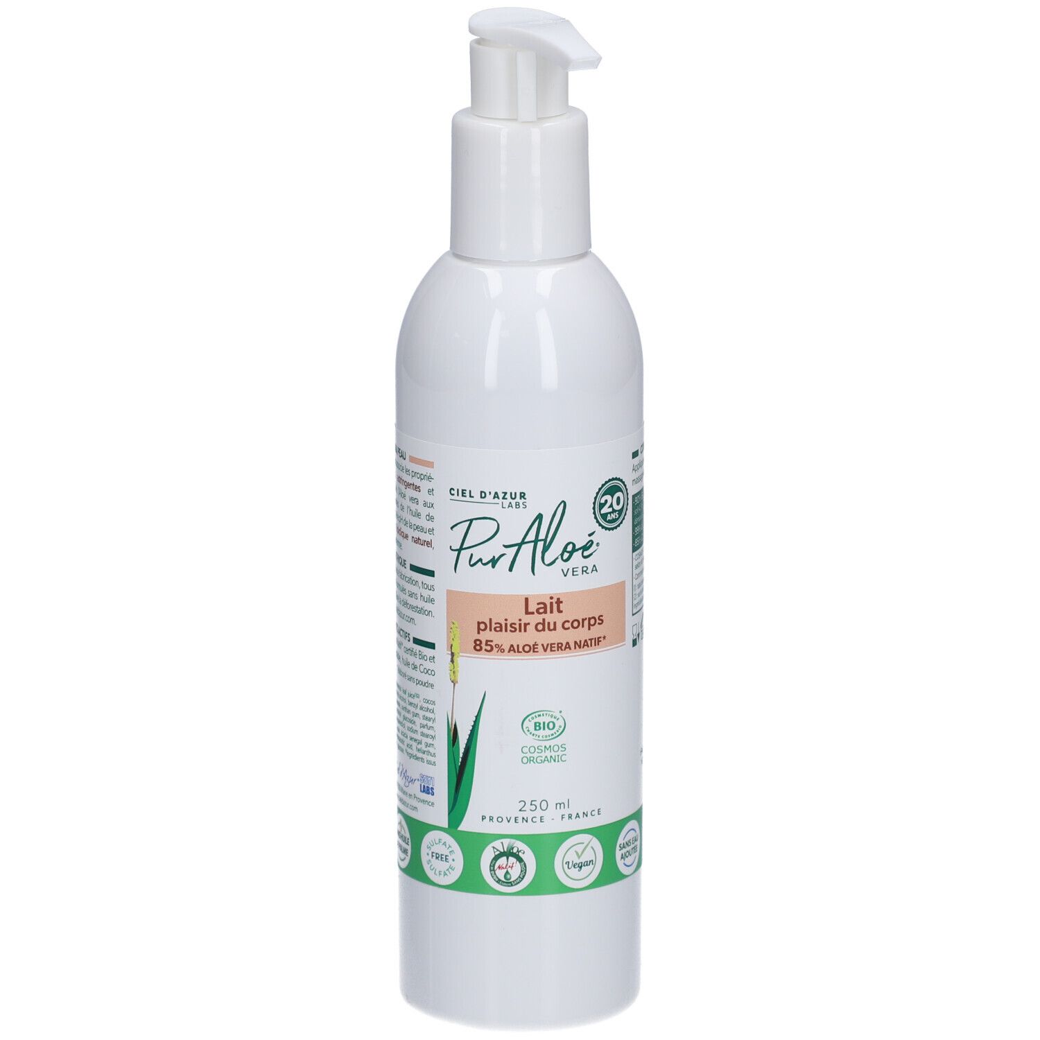 Flacon blanc avec pompe. Inscription: Pur Aloé Lait plaisir du corps 85% Aloe Vera Bio. Étiquette verte avec logo.