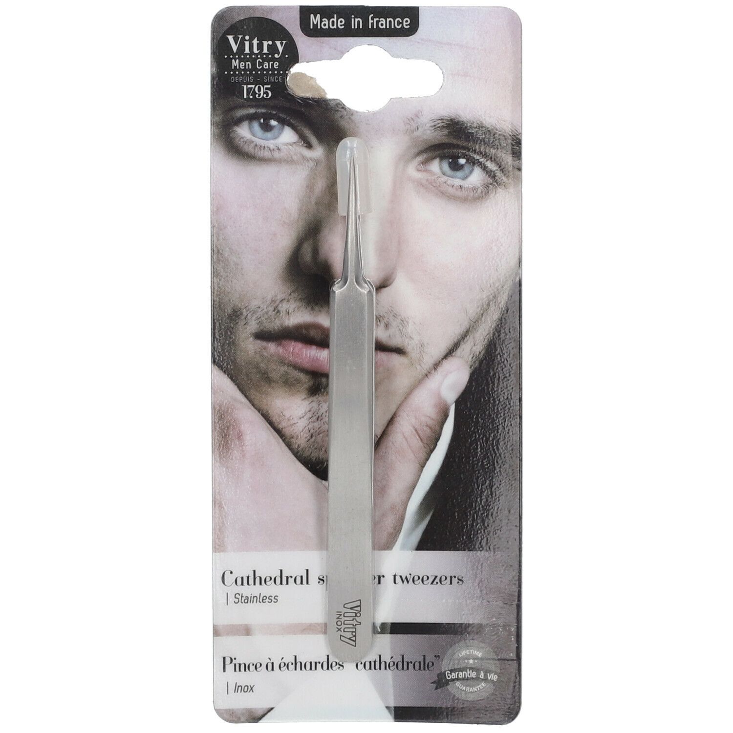 Pince à écharde mors cathédrale, inox. Sur blister, visage d'homme. Marque Vitry, texte.