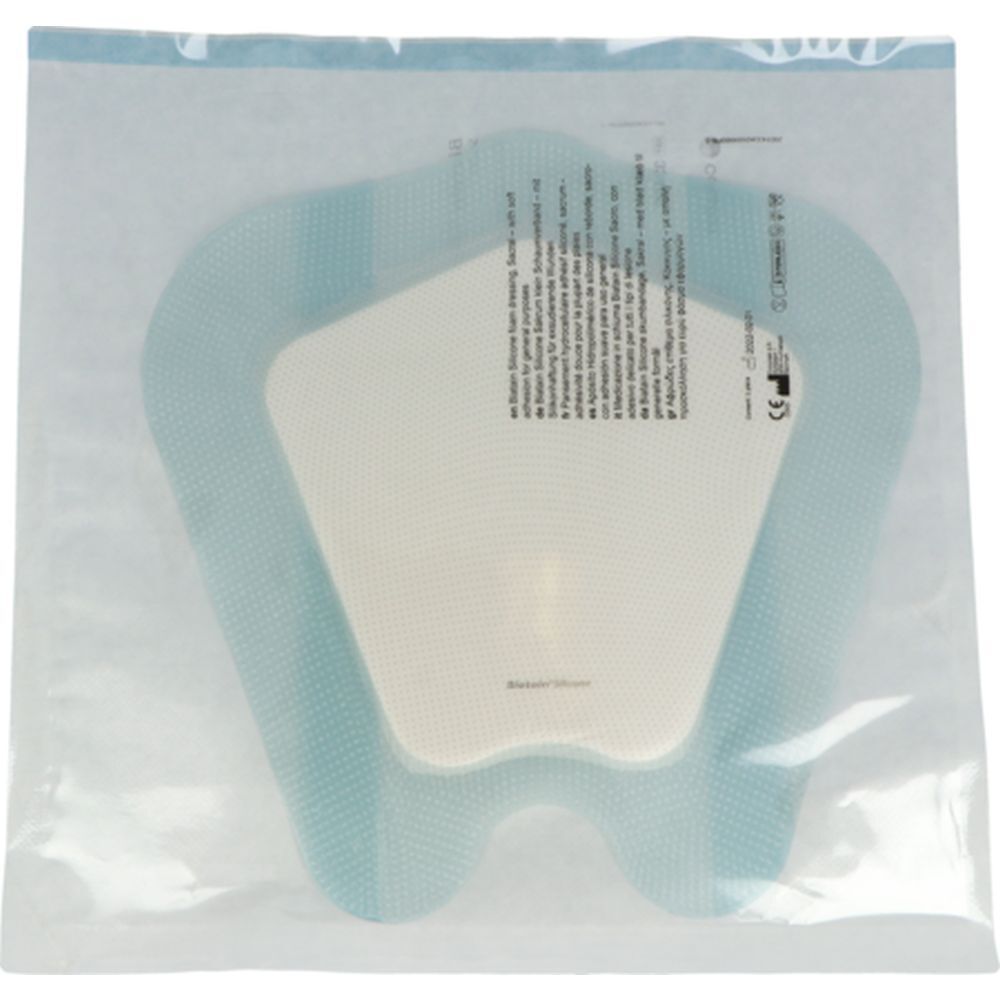 Pansement en sachet plastique. Bordure bleue, centre blanc. Informations produit sur l'emballage.