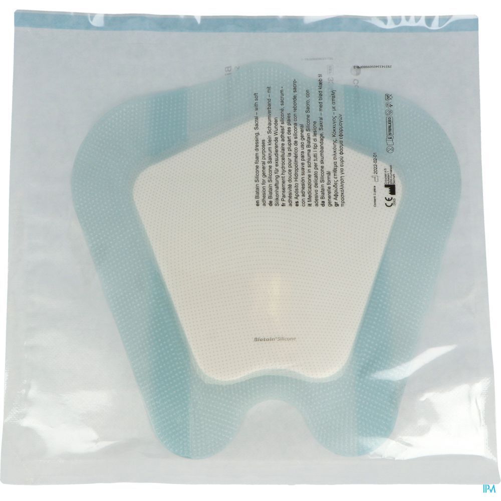Pansement en sachet plastique. Bordure bleue, centre blanc. Informations produit sur l'emballage.