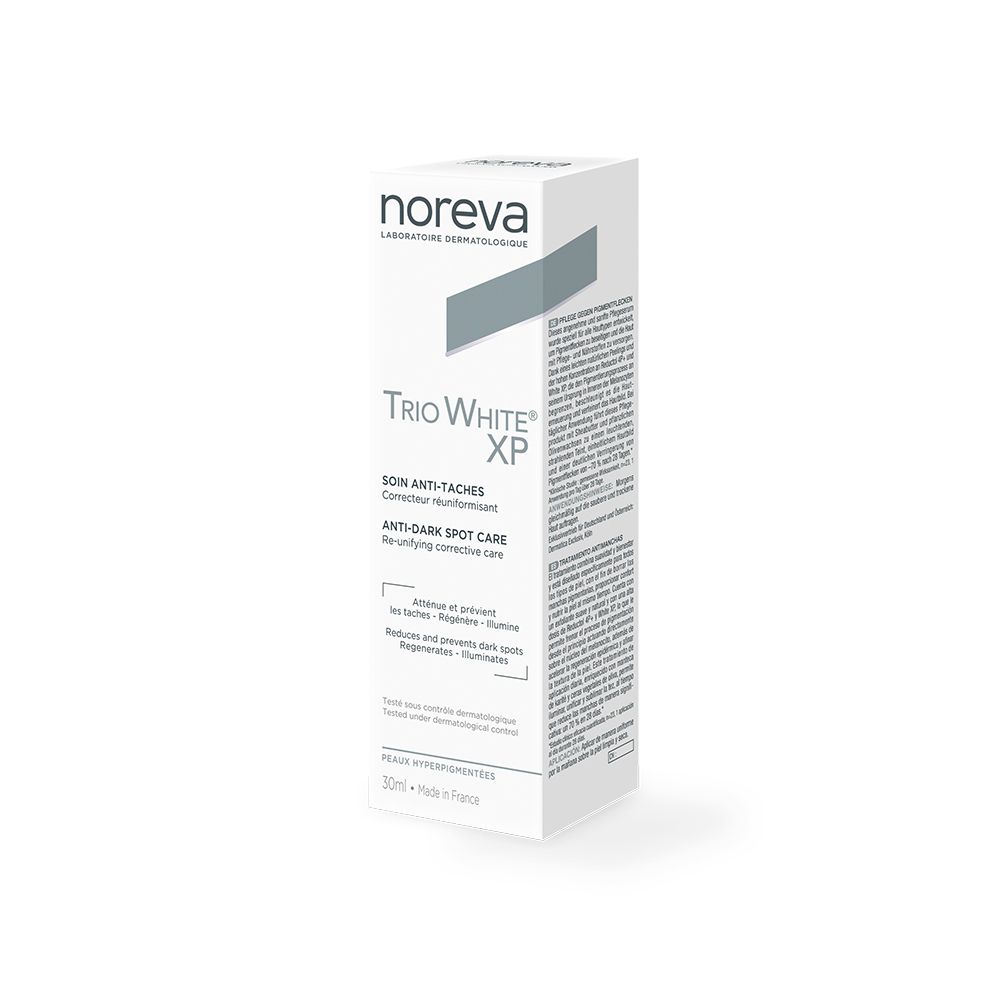 Emballage en carton. Inscriptions: noreva, Trio White XP, Anti-Dark Spot Care. Texte multilingue.