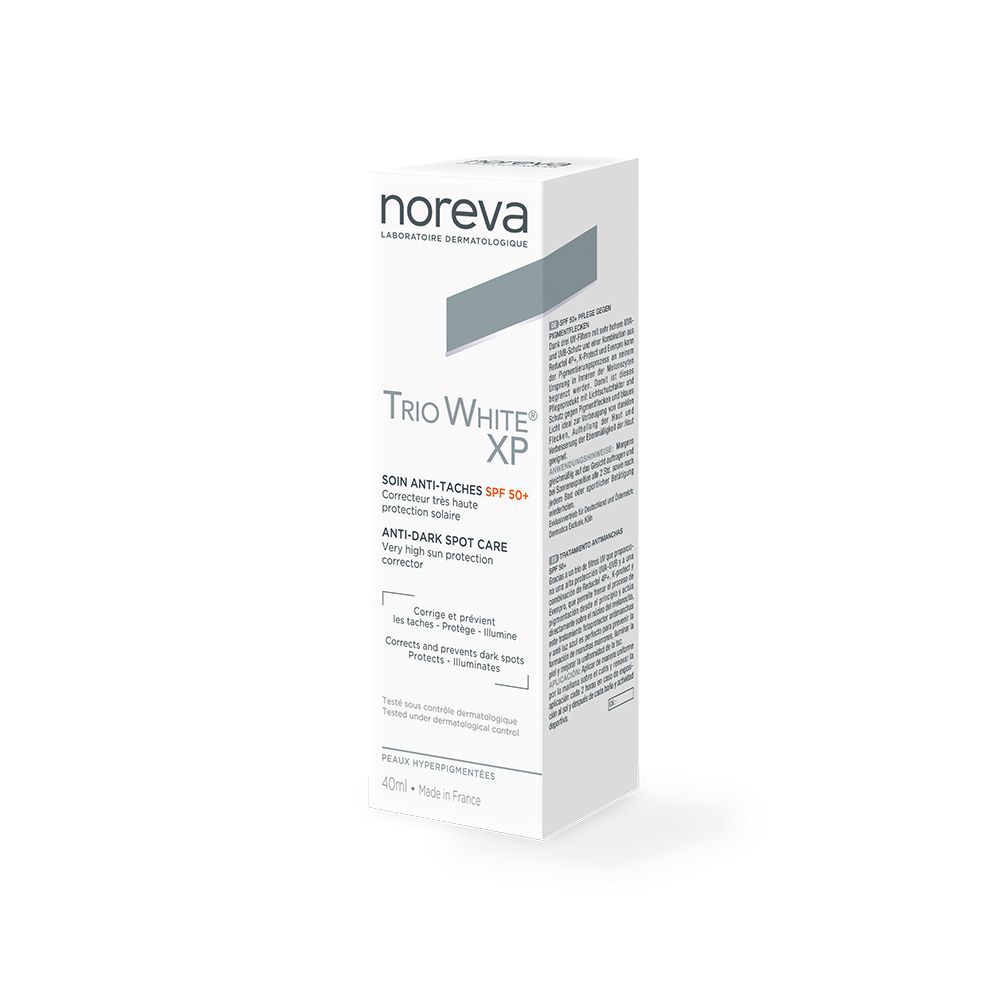 Weiße Verpackung mit Produktaufdruck. Marke: Noreva. Produkt: Trio White XP SPF 50+. Text: Anti-Pigmentfleckenpflege.