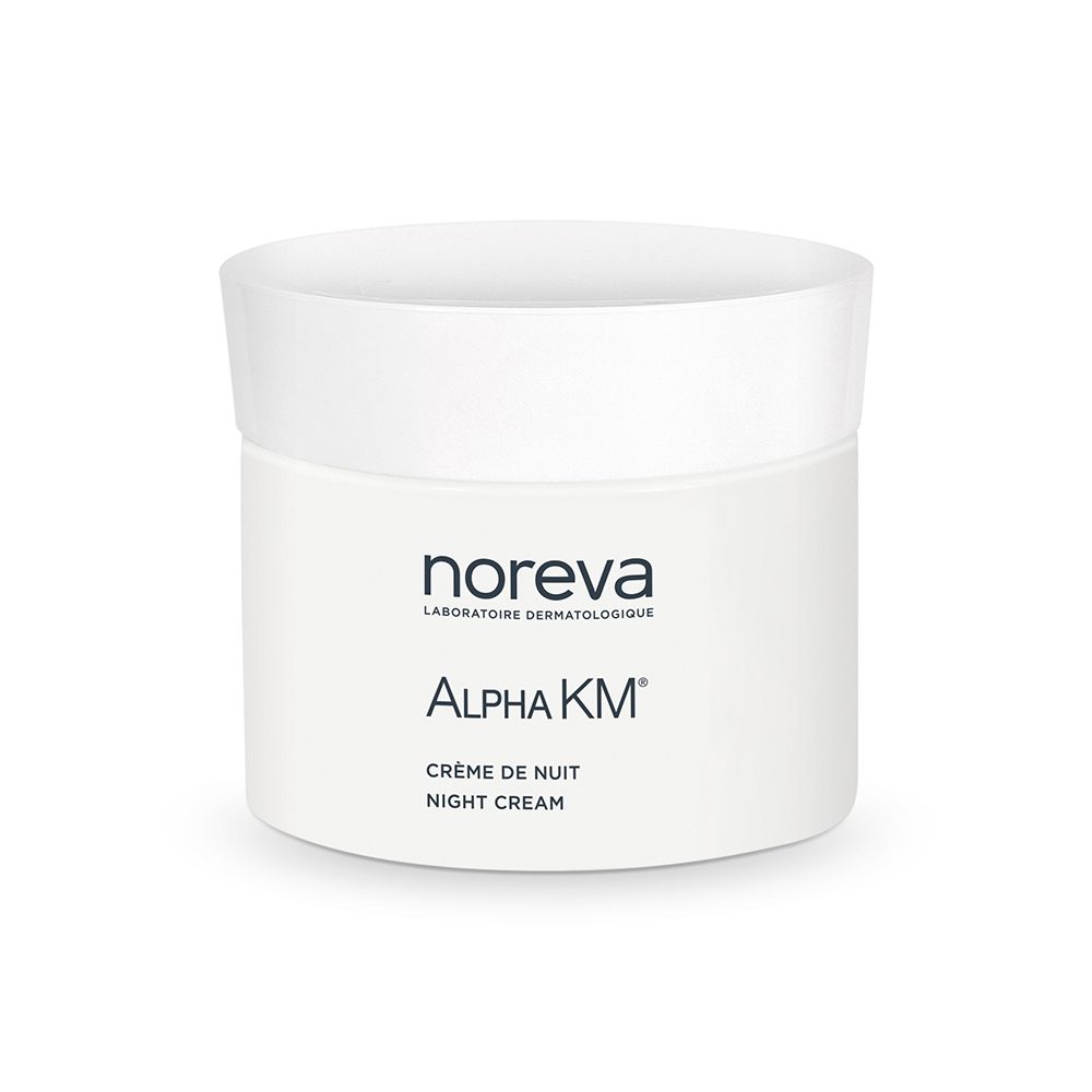 Pot de crème blanc avec couvercle. Inscription : Alpha KM, Crème de Nuit, Night Cream. Marque : Noreva.