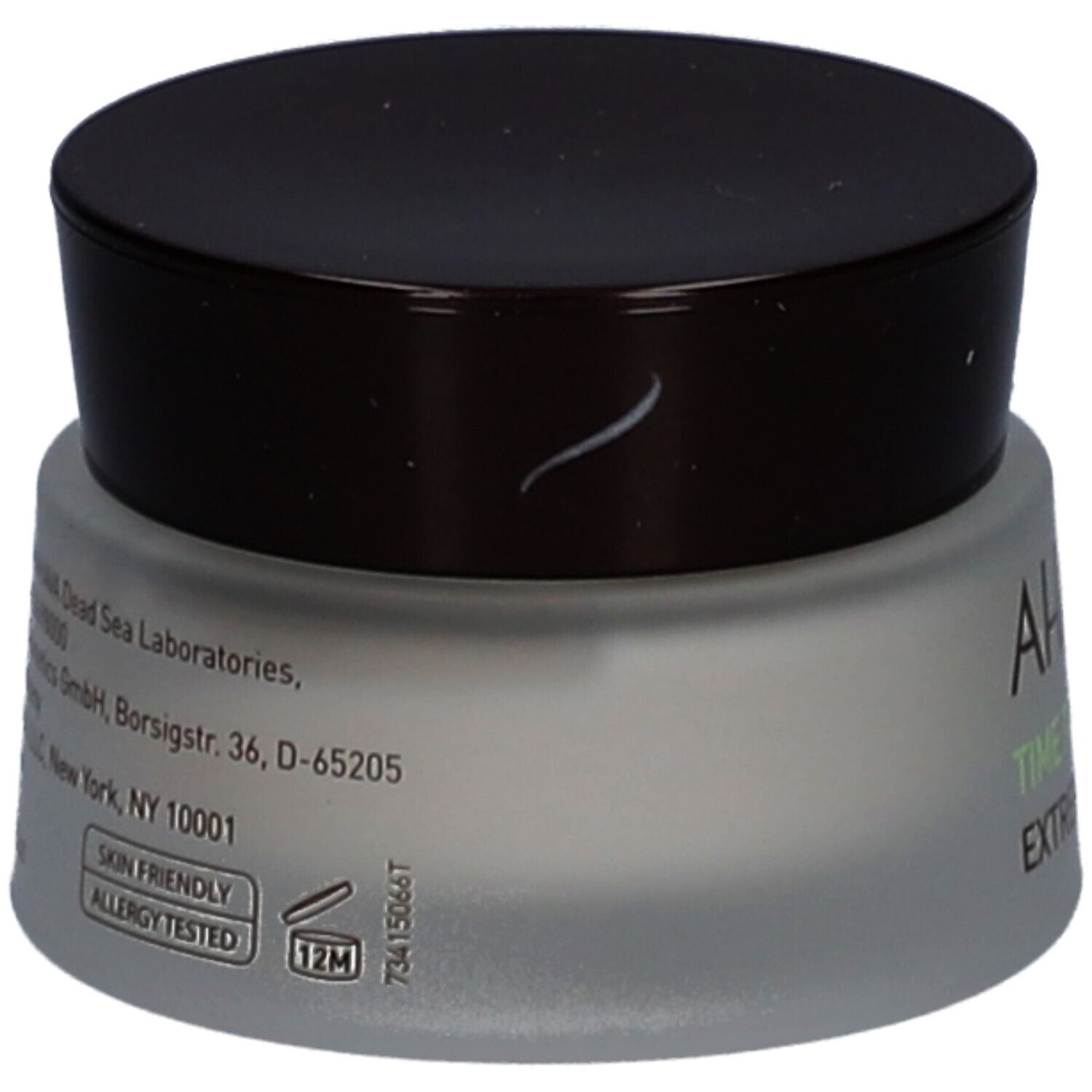 Pot de crème avec couvercle marron. Inscription : AHAVA, Time to Revitalize, Extreme Firming Eye Cream. Texte latéral.