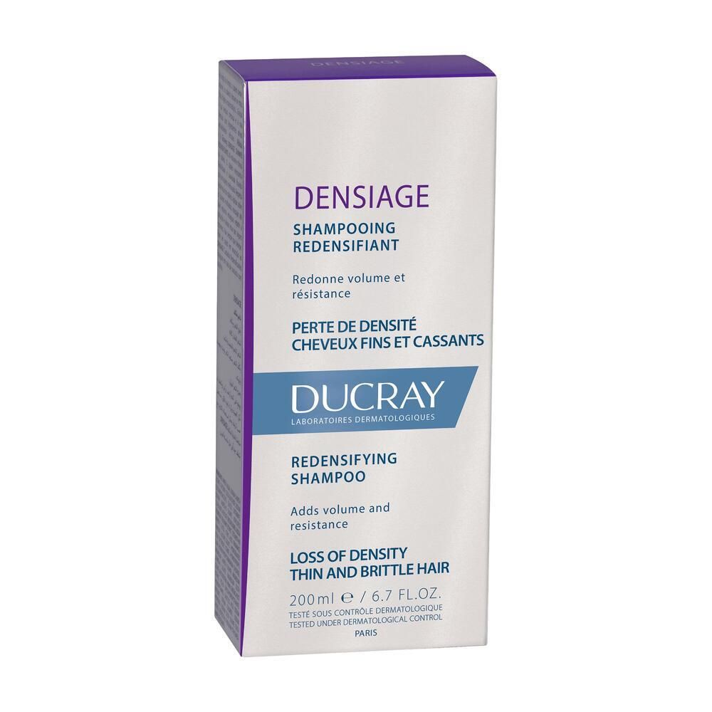 Kartonverpackung für Shampoo. Aufschrift: DUCRAY DENSIAGE Shampoo. Für dünnes, brüchiges Haar.