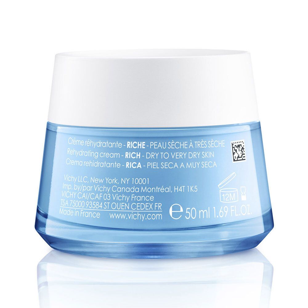 Rückseite eines blauen Cremeglases mit weißem Deckel. Text: Crème réhydratante, RICHE, peau sèche à très sèche. 50 ml.