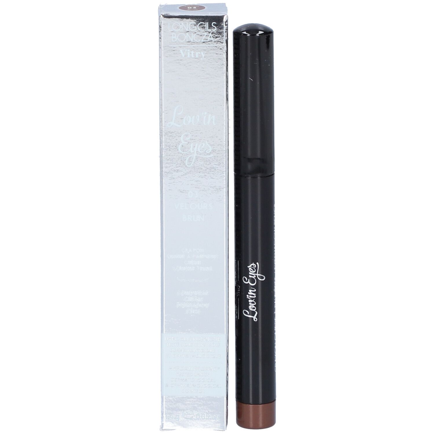 Crayon ombre à paupières et boîte. La boîte indique "Lovin' Eyes". Le crayon est noir avec une pointe marron.