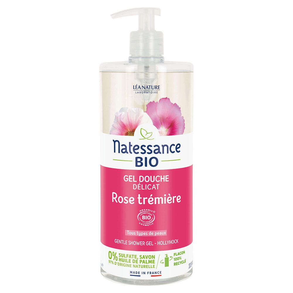 Flacon transparent avec pompe doseuse. Étiquette avec nom du produit, label bio et informations. Fleurs roses et blanches.