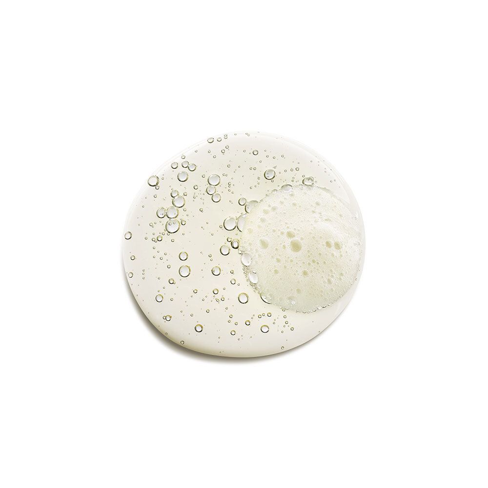 Tache circulaire du produit. Contient de petites bulles. Fond blanc.