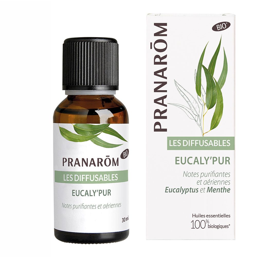Flacon en verre brun avec bouchon noir et étiquette. À côté, une boîte blanche avec informations produit et feuilles vertes.