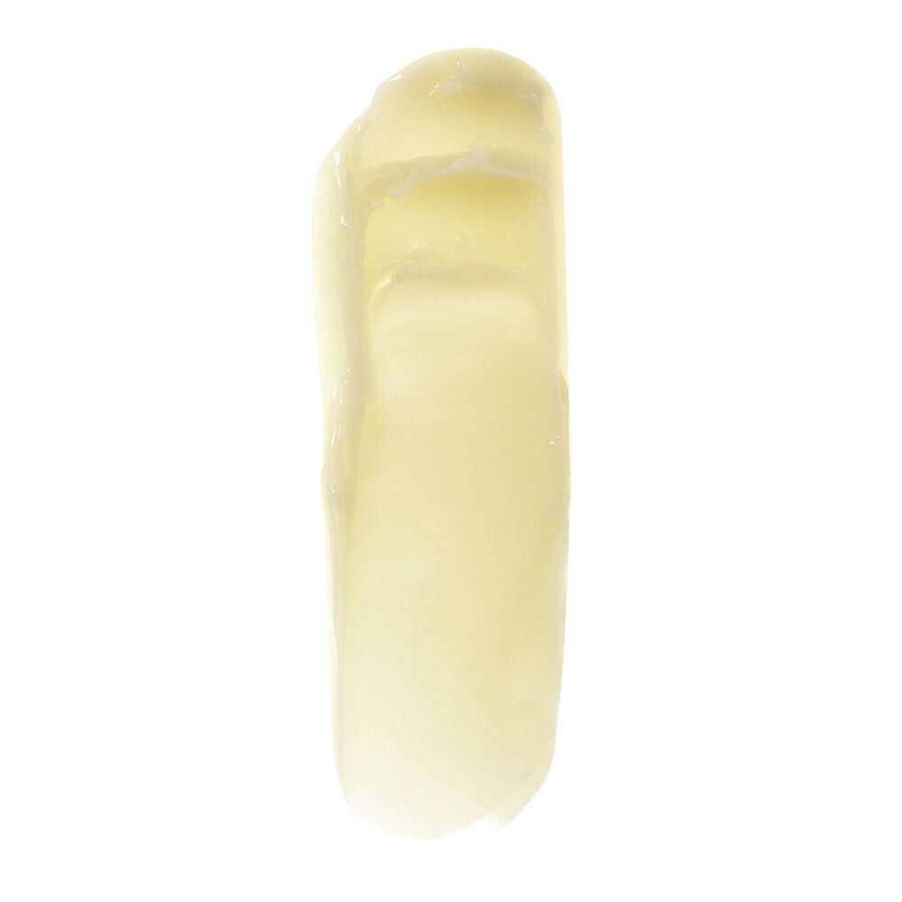 Texture de baume jaune. Sur fond blanc. Surface lisse et brillante.