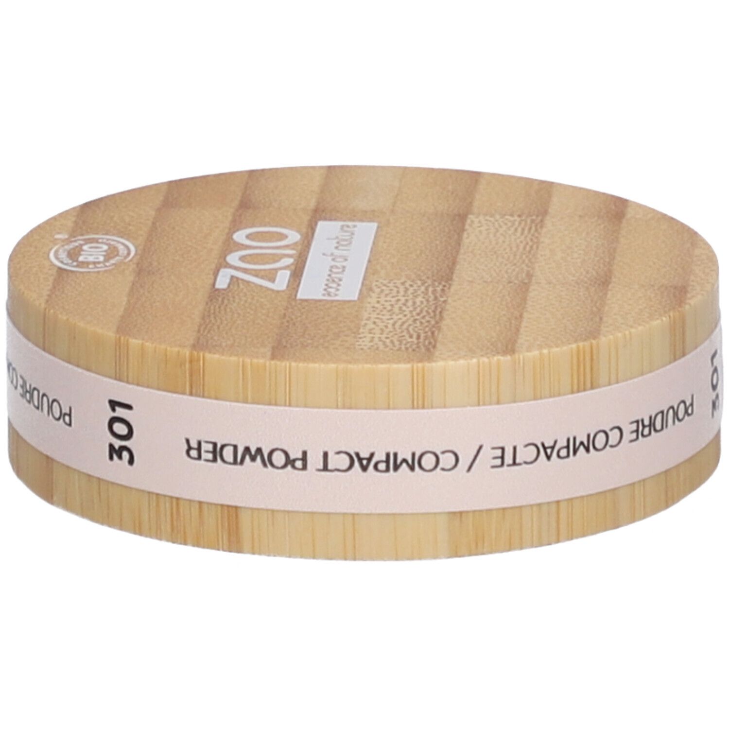 Compact poederverpakking van hout. Opschrift: ZAO, 301, Poudre Compacte/Compact Powder. Bio-keurmerk.