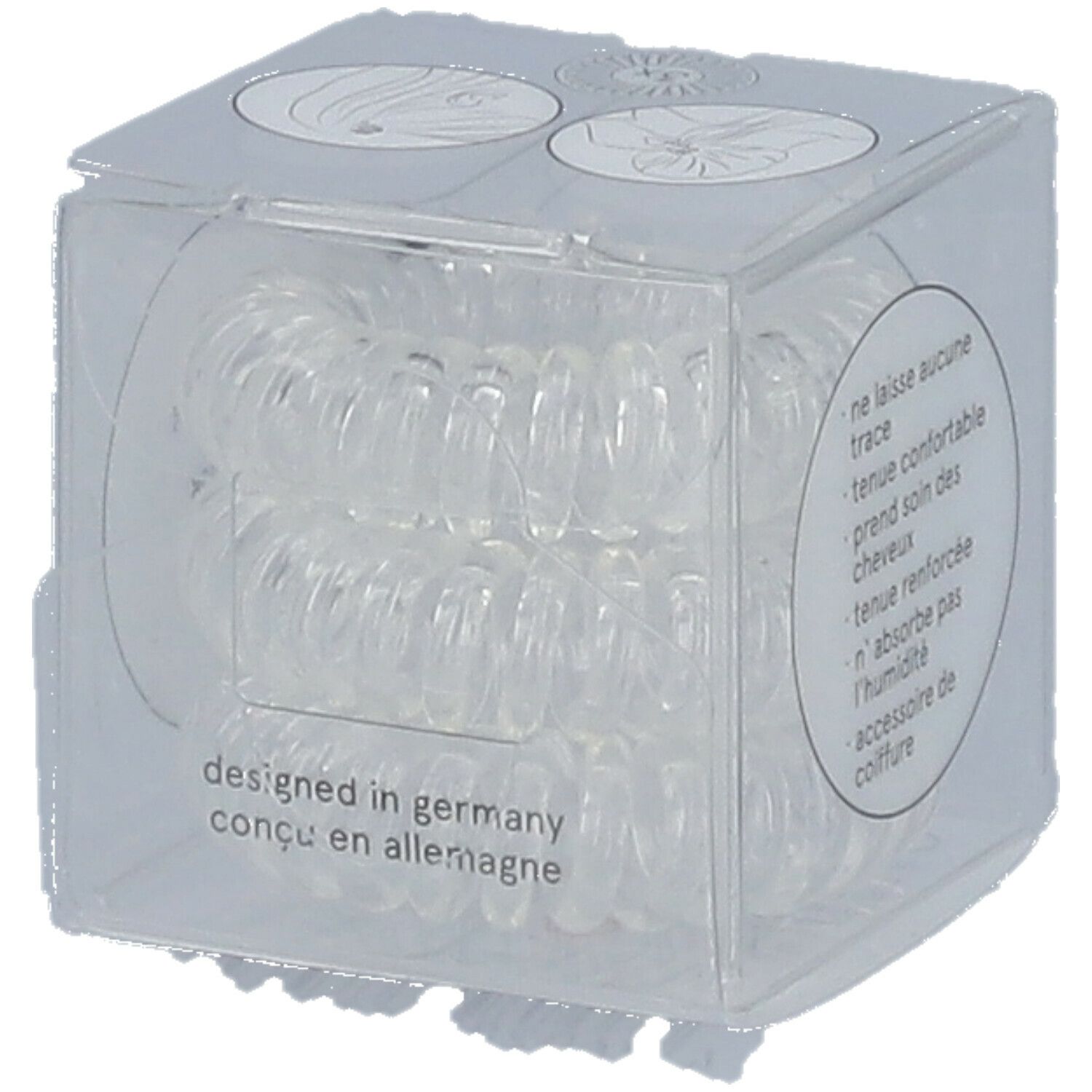 Klare, spiralförmige Haargummis in einer transparenten Würfelverpackung. Auf der Verpackung steht "designed in germany".