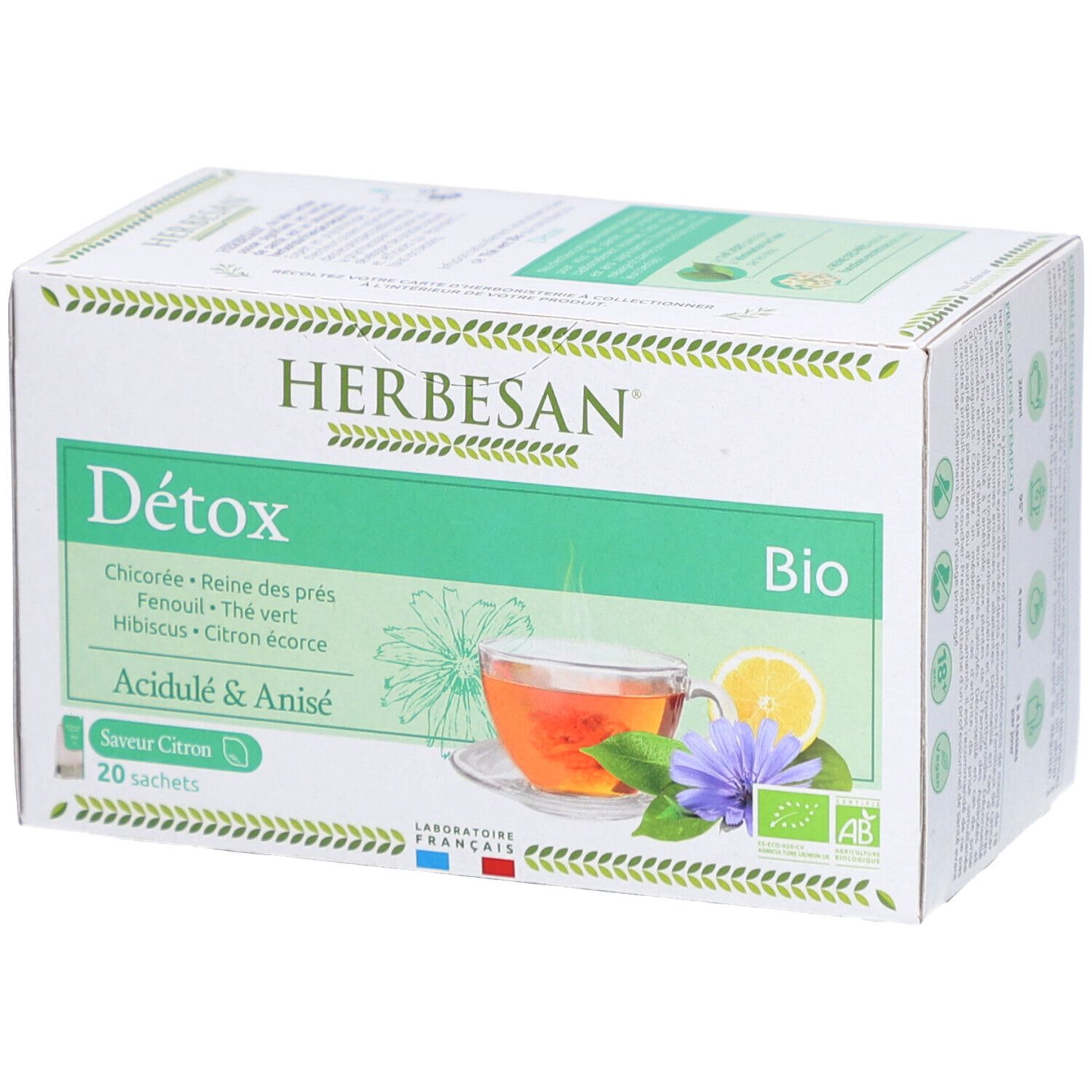Schachtel mit Herbesan Bio Detox Tee. Vorderseite mit Abbildung einer Tasse Tee, Zitrone und Blume. 20 Beutel.