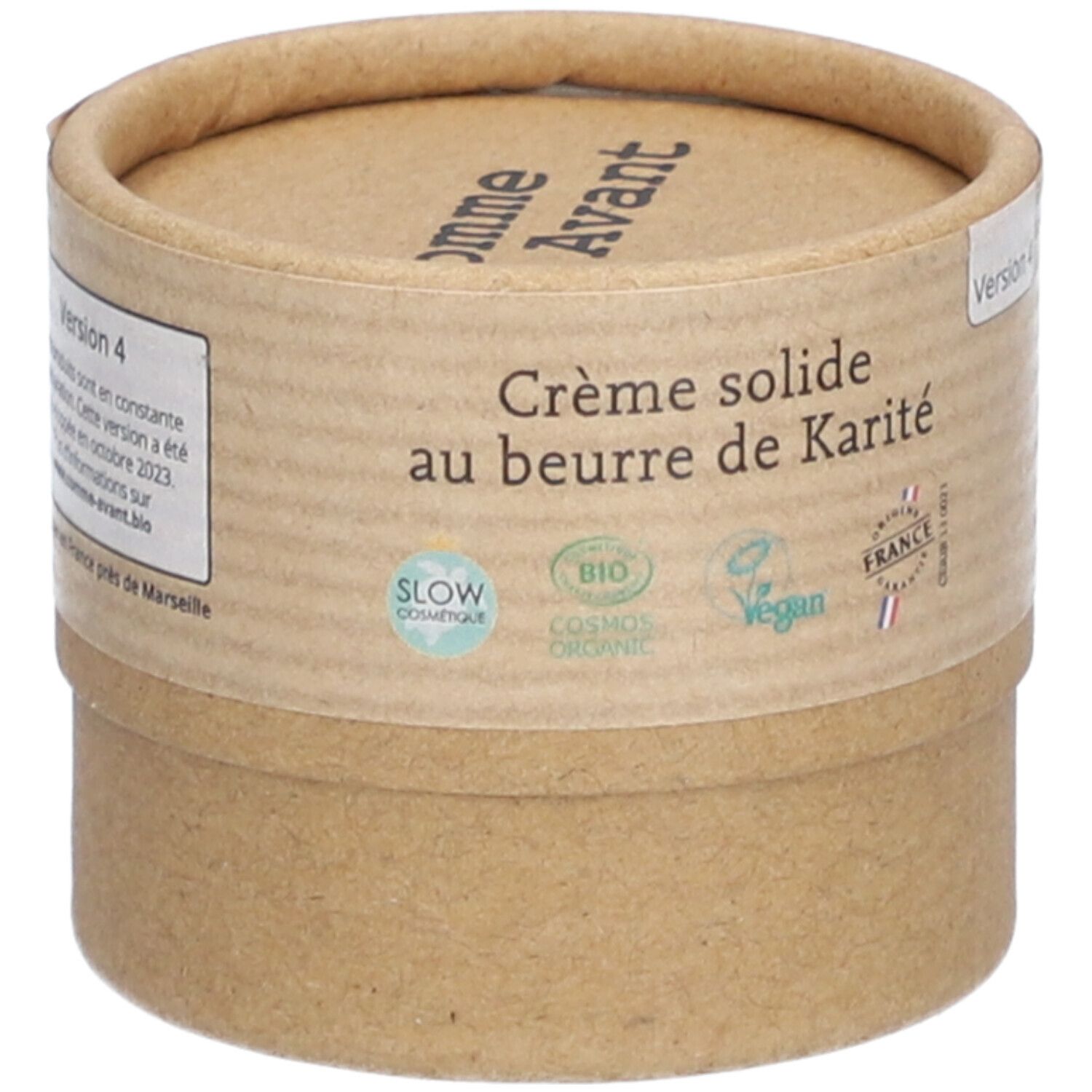 Emballage cylindrique. Inscription: Comme Avant, Crème solide au beurre de Karité. Logos: Slow Cosmétique, Bio Cosmos Organic, Vegan, France.